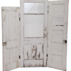 vintage doors together to create a white backdrop